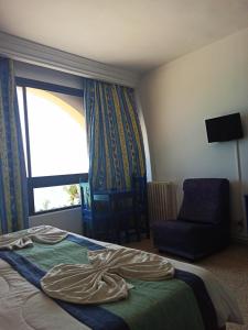 Postel nebo postele na pokoji v ubytování Residence Boujaafar