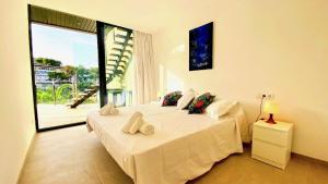 Cama o camas de una habitación en Mirador Blue - Penthouse Apartments with roof terrace