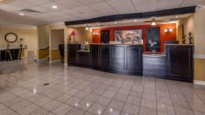a lobby with a waiting area in a hospital at SureStay Plus Hotel by Best Western Alvin in Alvin