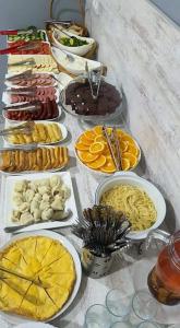 a table with many different types of food on it at Mestia 4 season in Mestia
