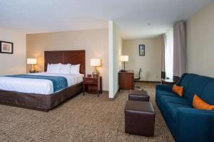 a hotel room with a bed and a couch at Comfort Inn Naugatuck-Shelton, CT in Naugatuck