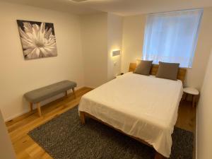 Un pat sau paturi într-o cameră la Britannia - Apartment Patagonia