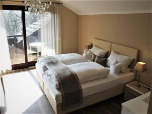 En eller flere senge i et værelse på Hotel garni Bellevue