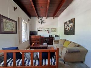 a living room with a couch and a table at Becketts Bliss in Worcester