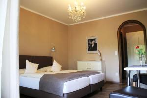 Postel nebo postele na pokoji v ubytování Hotel garni Bellevue