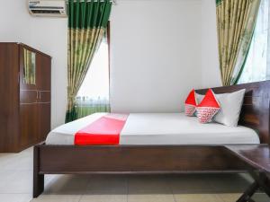 Letto o letti in una camera di OYO 3789 Bukit Somber Residence Syariah