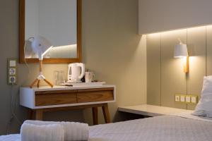 Katil atau katil-katil dalam bilik di Lefktron Hotel
