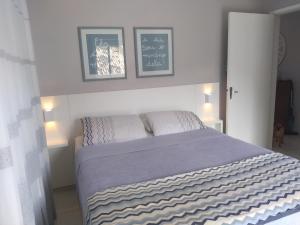 Кровать или кровати в номере Casa aconchegante Joaquina