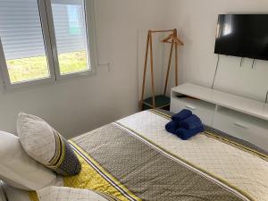 Postel nebo postele na pokoji v ubytování Les Trésors de Laurëlia