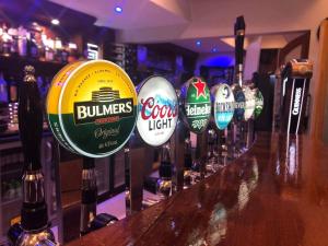 a bar with a bunch of bottles of beer at Balreask Bar, Restaurant & Guest Accommodation in Navan