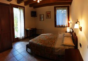 Posteľ alebo postele v izbe v ubytovaní Agriturismo L'Albara - Wines, Pool & SPA