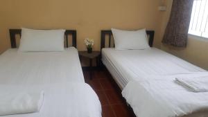 Postel nebo postele na pokoji v ubytování P.L.P Guesthouse - Mae Hong Son