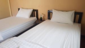 Postel nebo postele na pokoji v ubytování P.L.P Guesthouse - Mae Hong Son