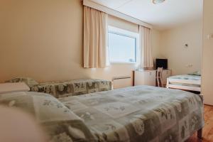 Postel nebo postele na pokoji v ubytování Staadioni Hotel
