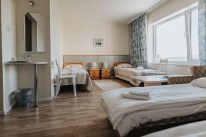 Postel nebo postele na pokoji v ubytování Staadioni Hotel