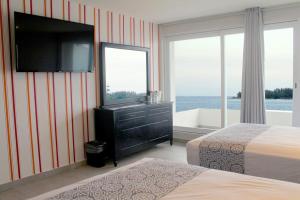 Postel nebo postele na pokoji v ubytování Hotel Costa Verde