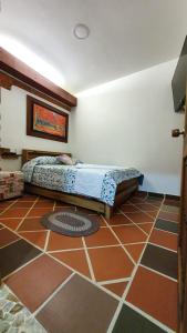 Vuode tai vuoteita majoituspaikassa El Quijote Apartahotel