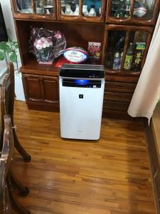 a refrigerator sitting on the floor in a kitchen at Kami House in Amami