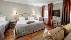 Postel nebo postele na pokoji v ubytování Blommenhof Hotel