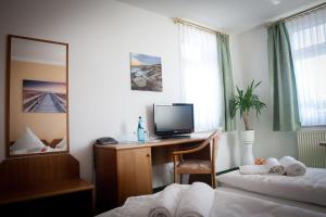 TV a/nebo společenská místnost v ubytování Ratskeller Thum