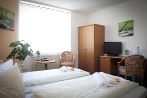 Postel nebo postele na pokoji v ubytování Ratskeller Thum