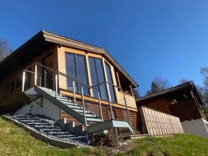 a house with stairs on the side of it at Ferienhaus Gasteg in Maria Alm am Steinernen Meer
