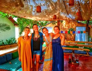 a group of four women posing for a picture at GoYm Resort in Arambol