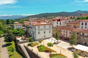 an aerial view of a town with buildings at Hotel Os Poetas in Ponte da Barca