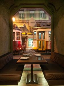 a dining room with a train on the tracks at Figueira by The Beautique Hotels in Lisbon