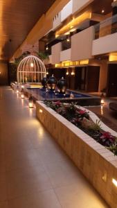 a lobby with a row of lights in a building at Sweet Garden Guest House in Malang