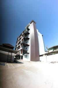 a large building with a tall building at P Bliss hotel in Phayao
