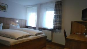 Postel nebo postele na pokoji v ubytování Gasthaus Gonnermann