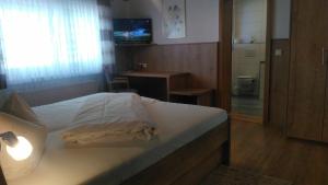 Postel nebo postele na pokoji v ubytování Gasthaus Gonnermann