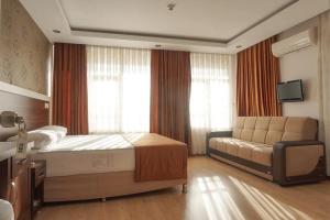 Postel nebo postele na pokoji v ubytování River Hotel