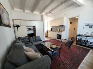a living room with a couch and a table at Best view Pula in Pula