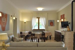 a living room with a couch and a dining room at B&B Antico Sentiero in Cesena