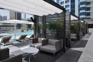 a hotel room with a balcony overlooking the ocean at InterContinental Dubai Marina, an IHG Hotel in Dubai