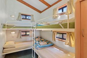 a bedroom with bunk beds in a tiny house at Discovery Parks - Whyalla Foreshore in Whyalla