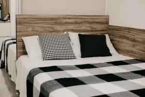 Llit o llits en una habitació de FLAT MODERNO E ACONCHEGANTE