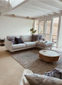 a living room with a couch and a coffee table at The Loft - beautiful central Barossa apartment in Tanunda