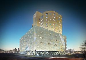 a tall building with a glass facade at The Riverside Hotel in Seoul