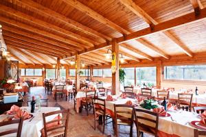 a dining room with tables and chairs in it at Locanda Belvedere Da Stefano in Rocchetta a Volturno