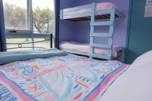 A bunk bed or bunk beds in a room at Anglesea Backpackers