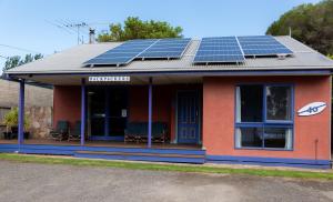 a building with solar panels on the roof at Anglesea Backpackers in Anglesea