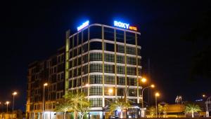 a building with a royal inn sign on top of it at Roxy Hotel & Apartments in Kuching