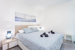 Postel nebo postele na pokoji v ubytování MEDANO Surf Beach Holiday Home by Sunkeyrents