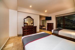Postel nebo postele na pokoji v ubytování Hotel Imperial