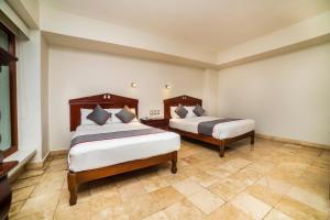 Postel nebo postele na pokoji v ubytování Hotel Imperial