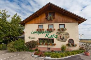 a building with a sign on the side of it at Hotel Landgasthof Ratz in Rheinau