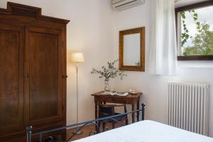 Postel nebo postele na pokoji v ubytování Podere Sant'Alessandro